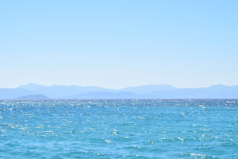 blue sea under blue sky during daytime