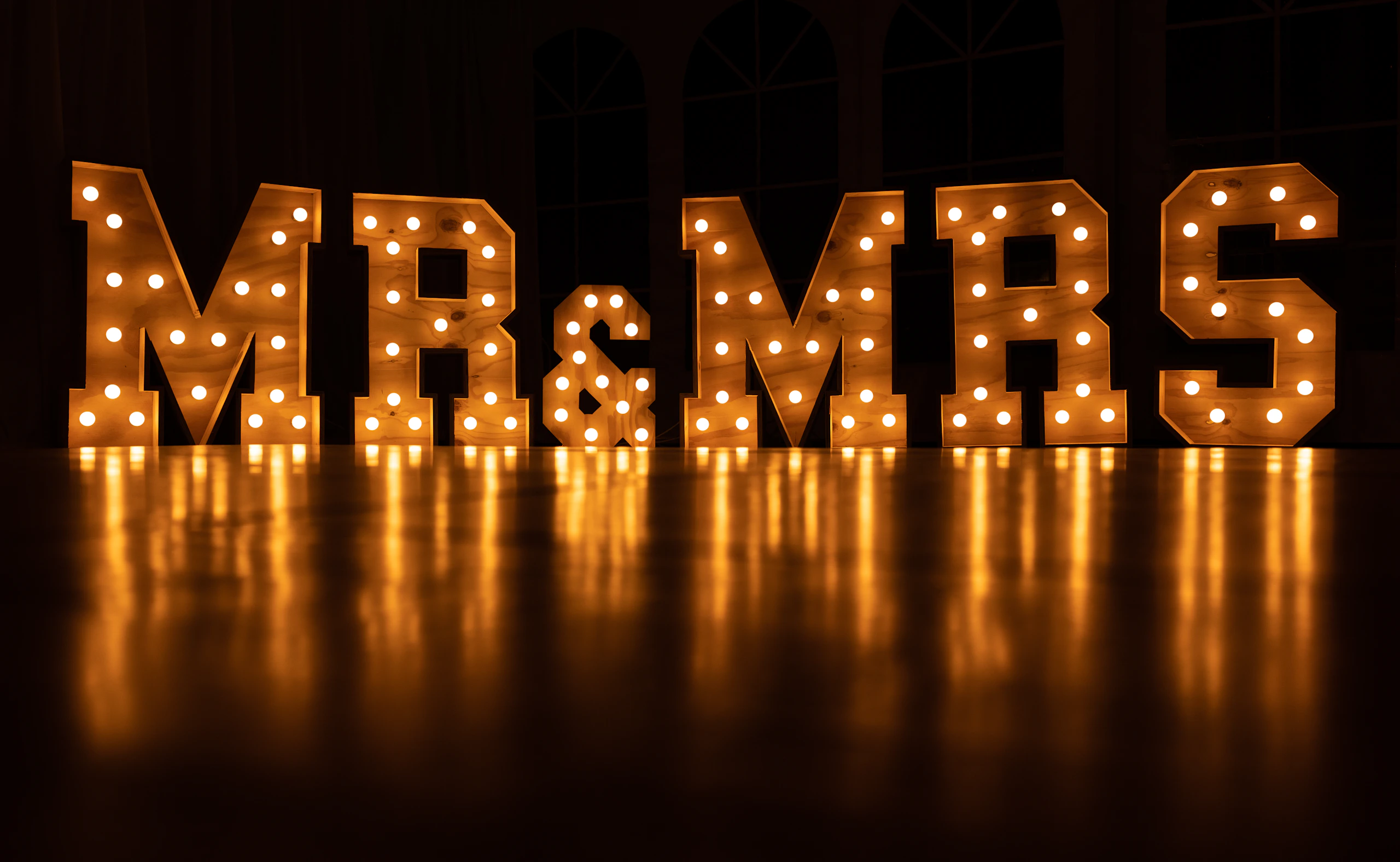 Illuminated marquee letters at a wedding reception
