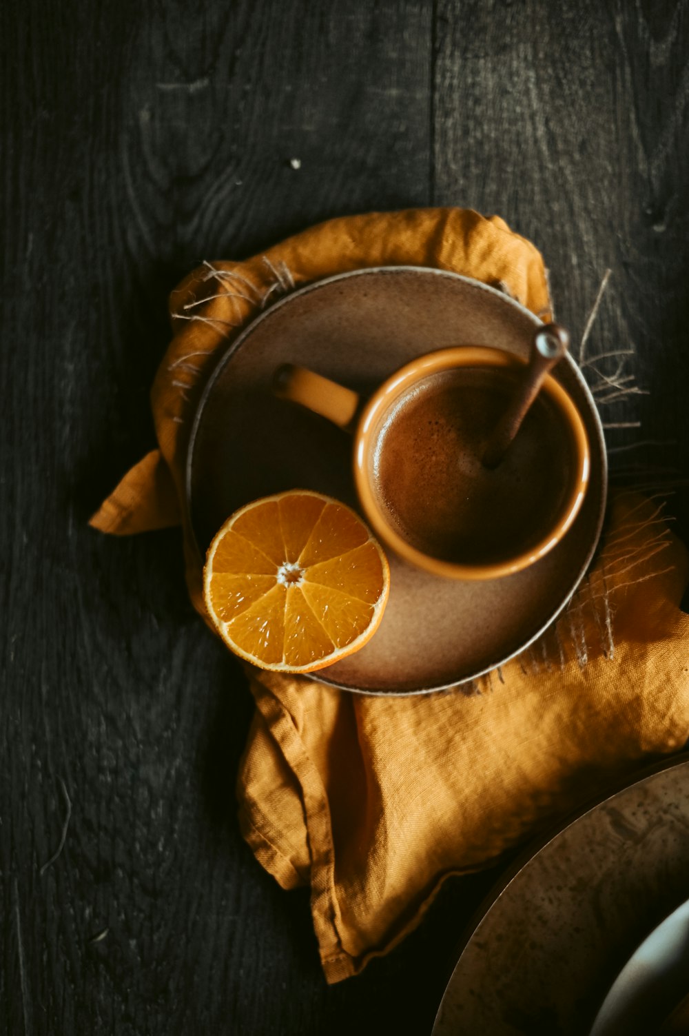 brown ceramic mug with brown liquid inside