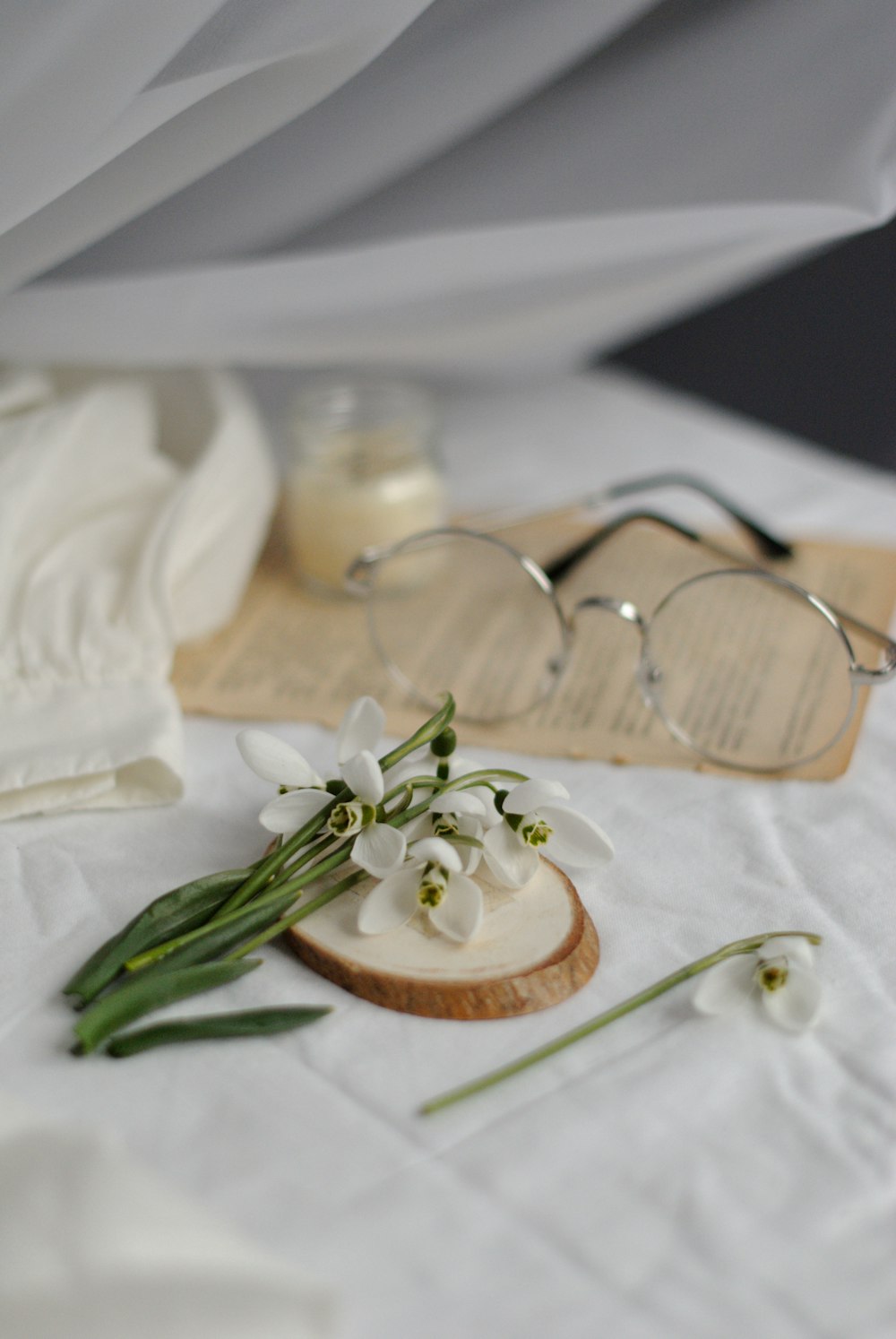 white flowers on brown wooden table