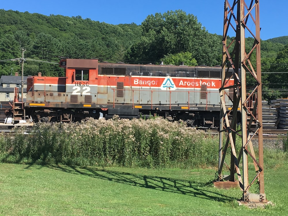 red and white train on rail tracks