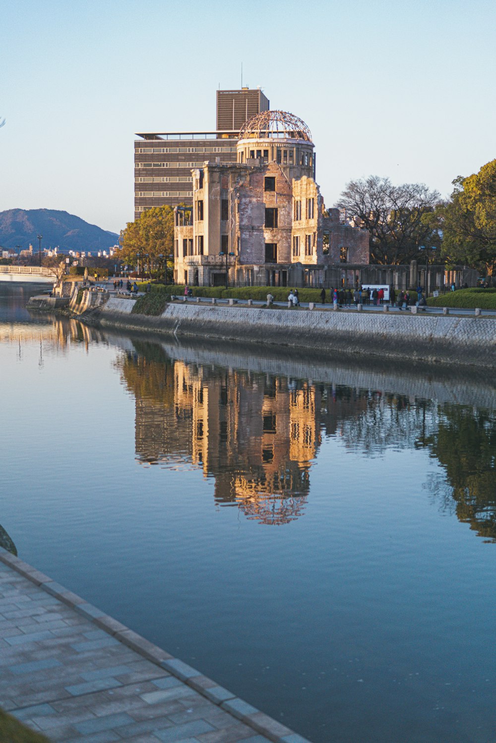 brown concrete building near body of water during daytime