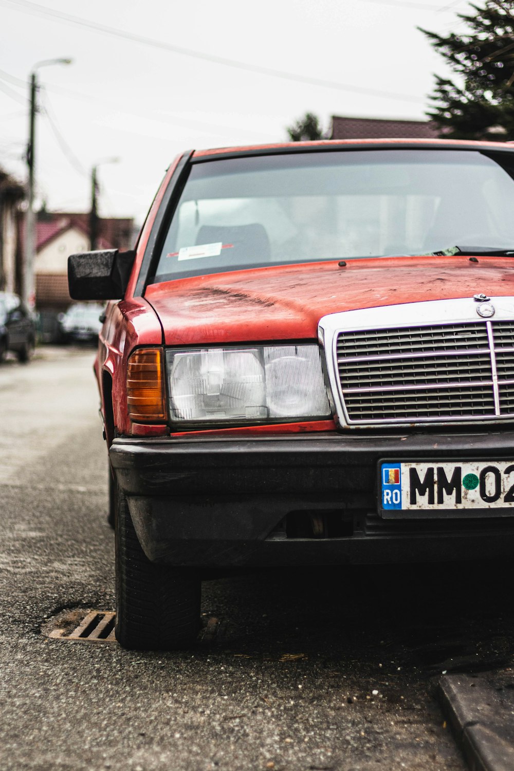 red and black car on road during daytime