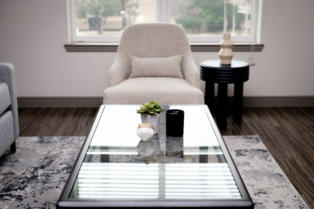 white and black table lamp on glass table