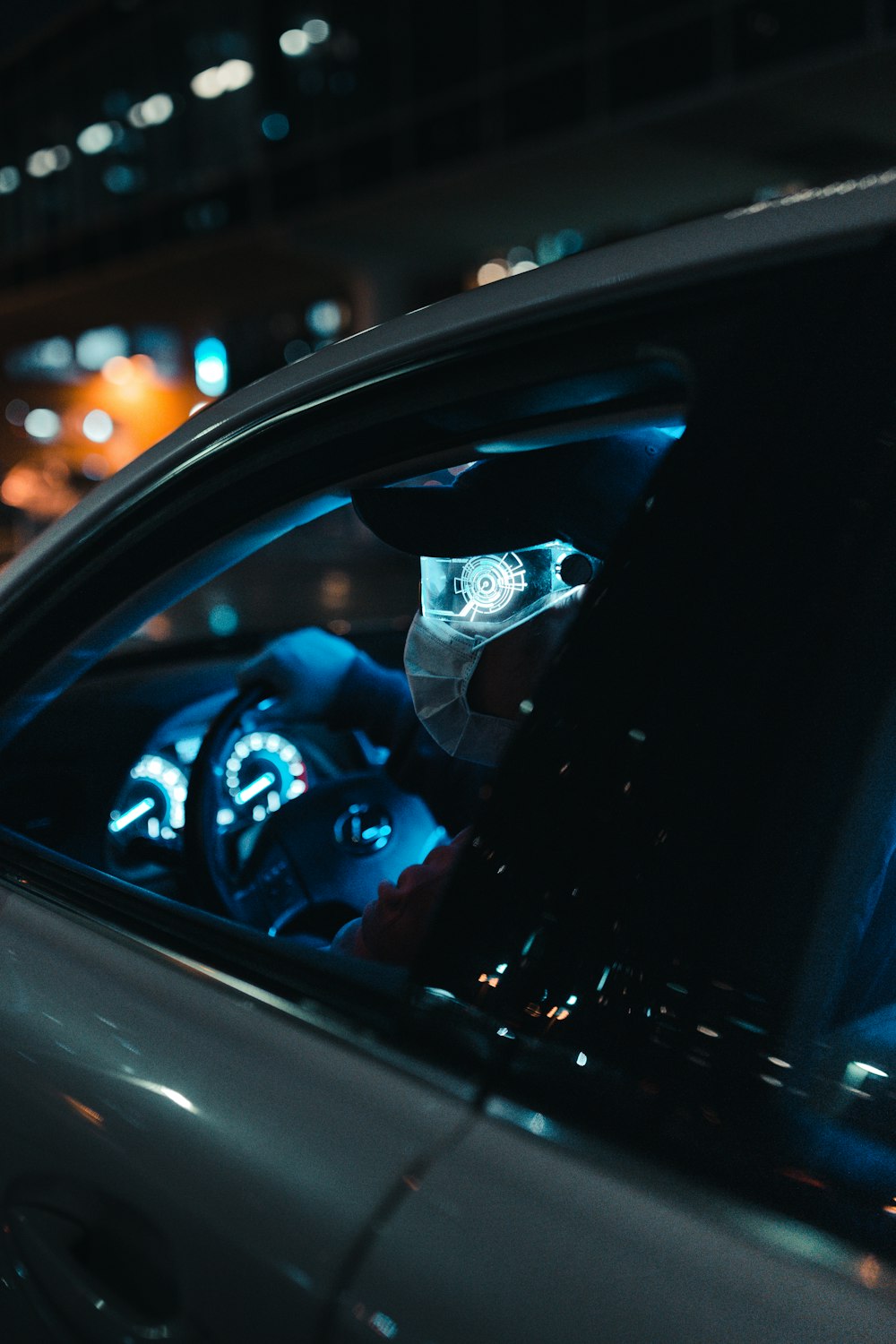 person in blue denim jeans sitting inside car