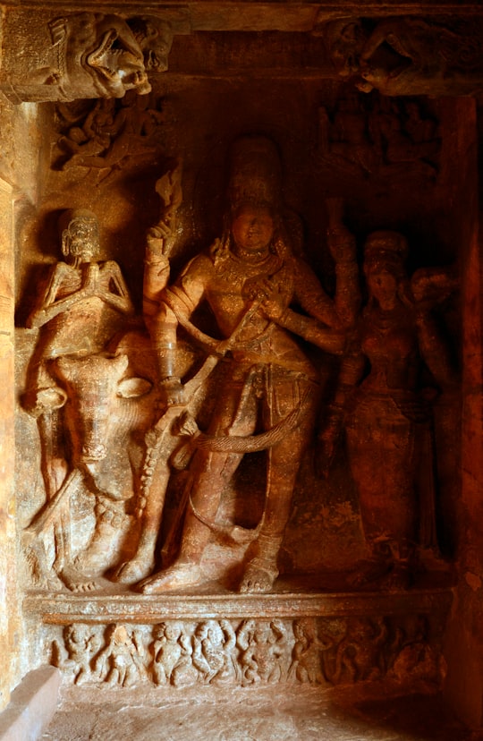 brown concrete statue of man in Karnataka India