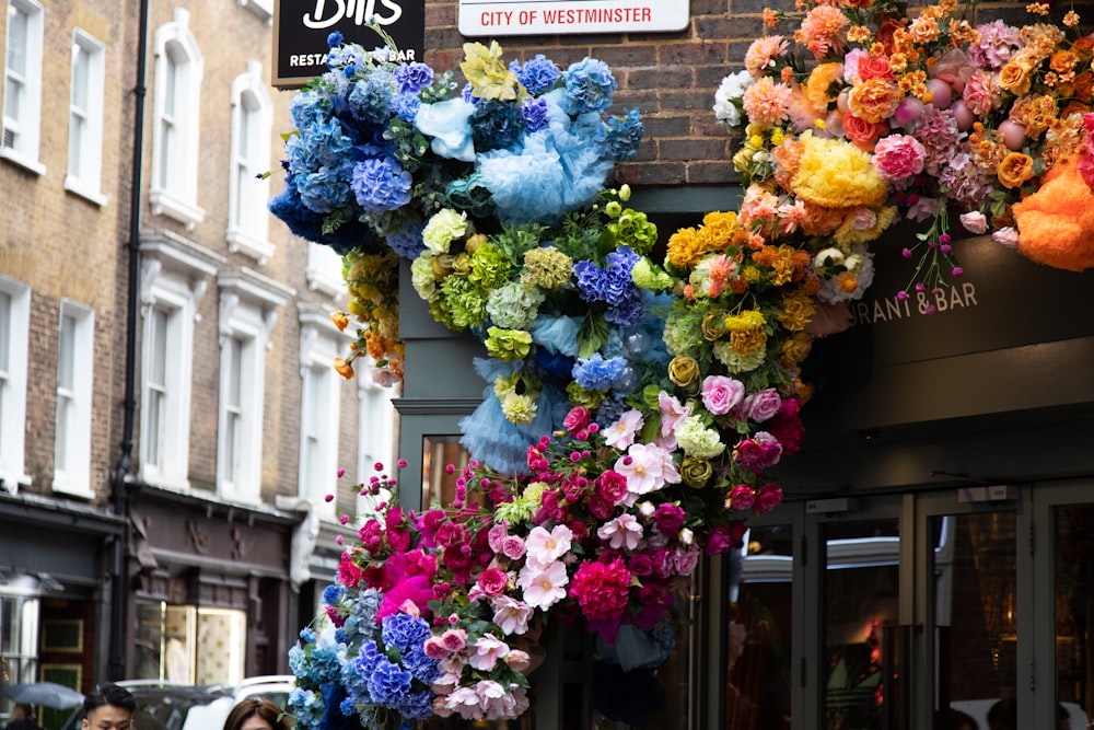 yellow blue and pink flowers on window