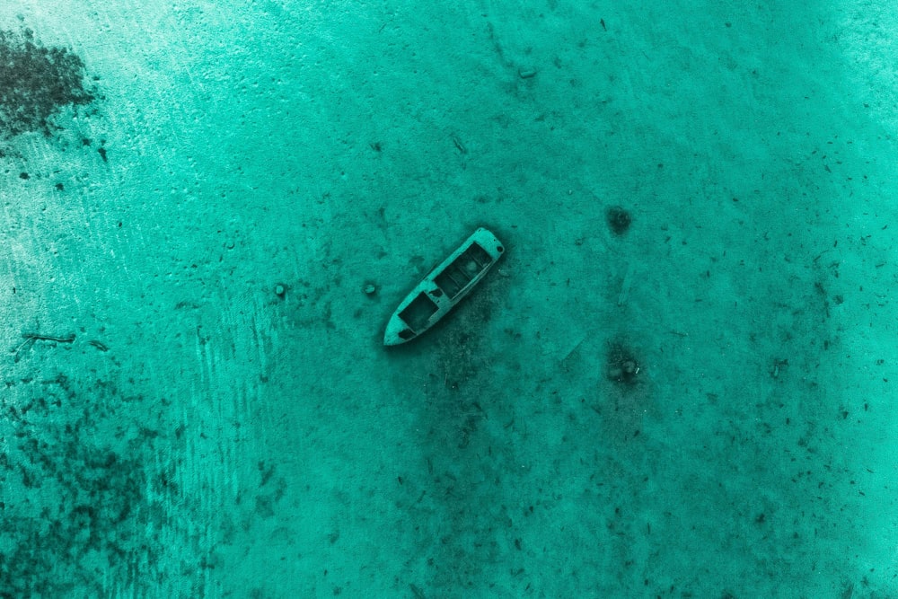 aerial view of boat on body of water during daytime
