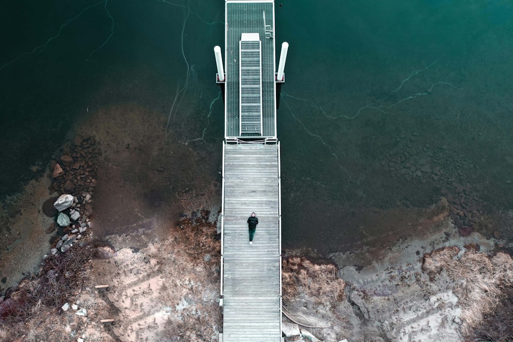 aerial view of gray concrete bridge