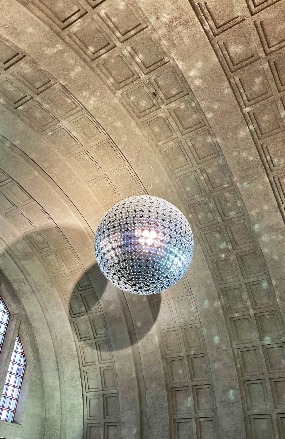 a chandelier hanging from the ceiling of a building