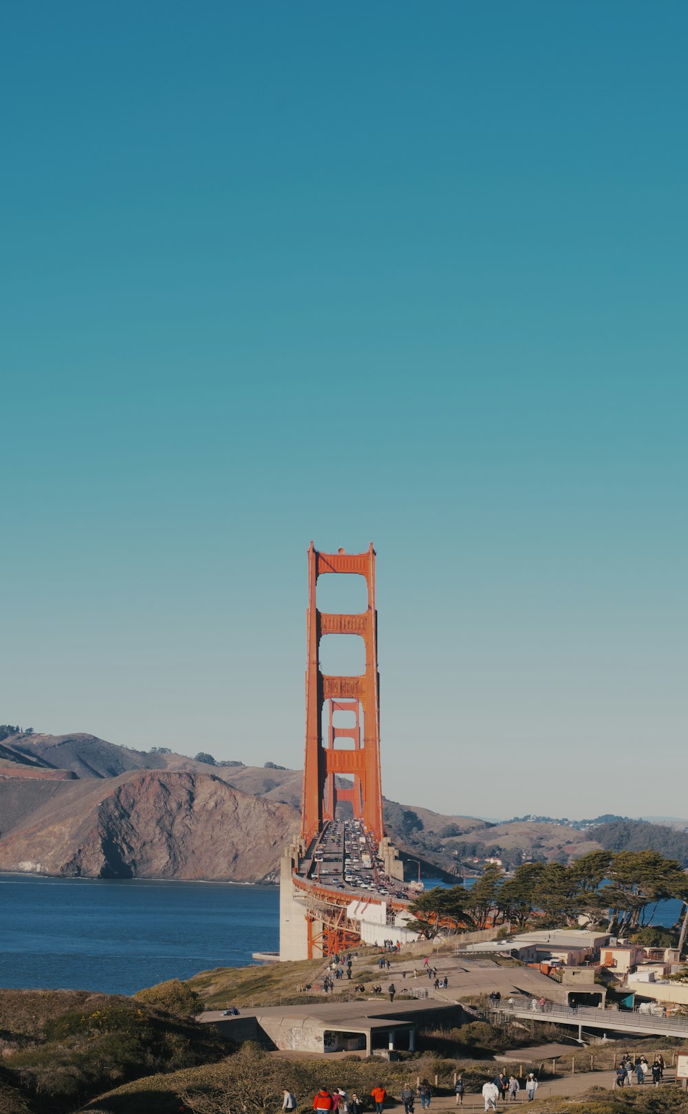 brown bridge over the mountains during daytime