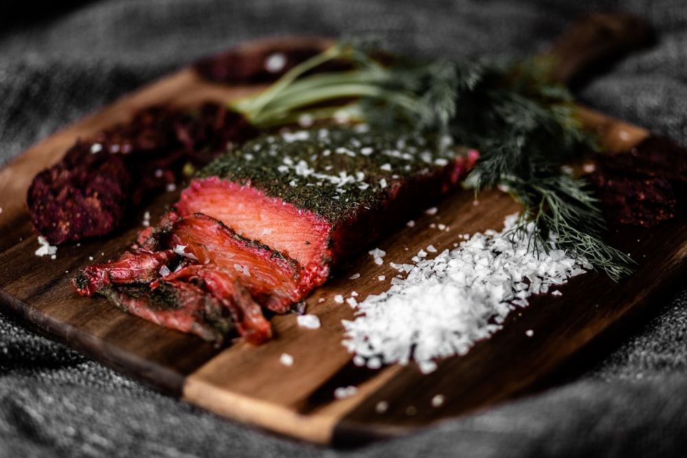 sliced meat on brown wooden chopping board