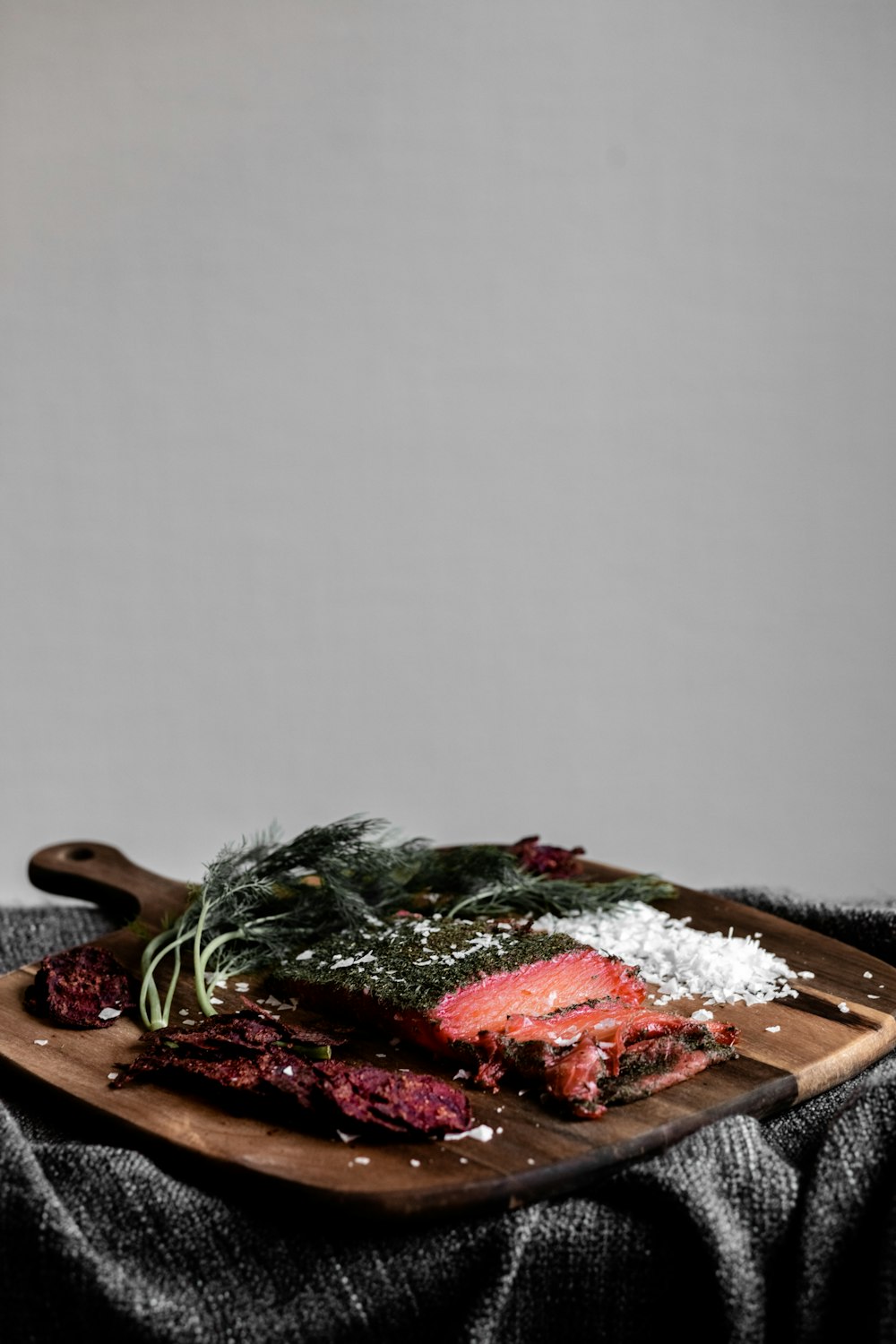 green and red vegetable on brown wooden chopping board