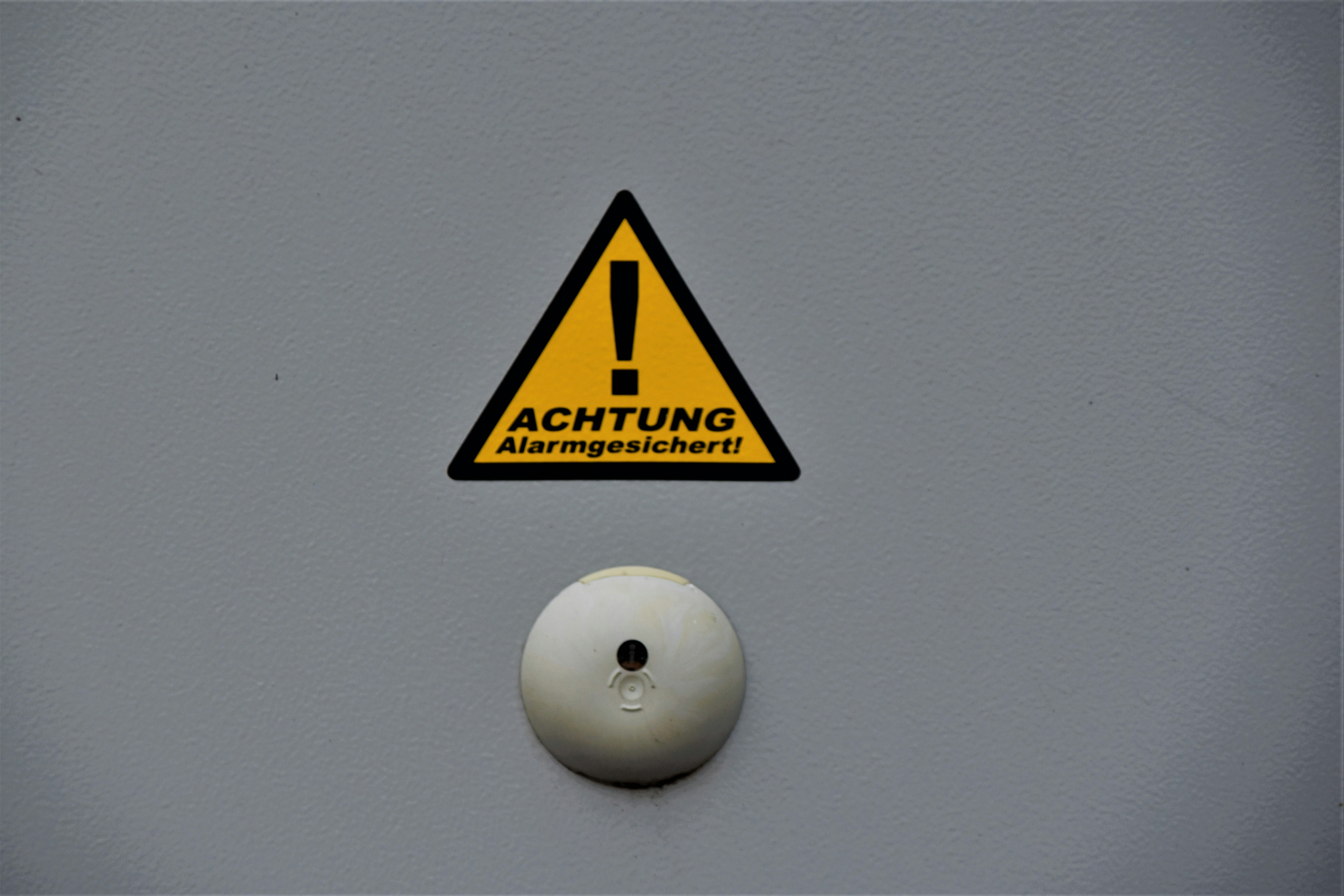 yellow and black caution sign