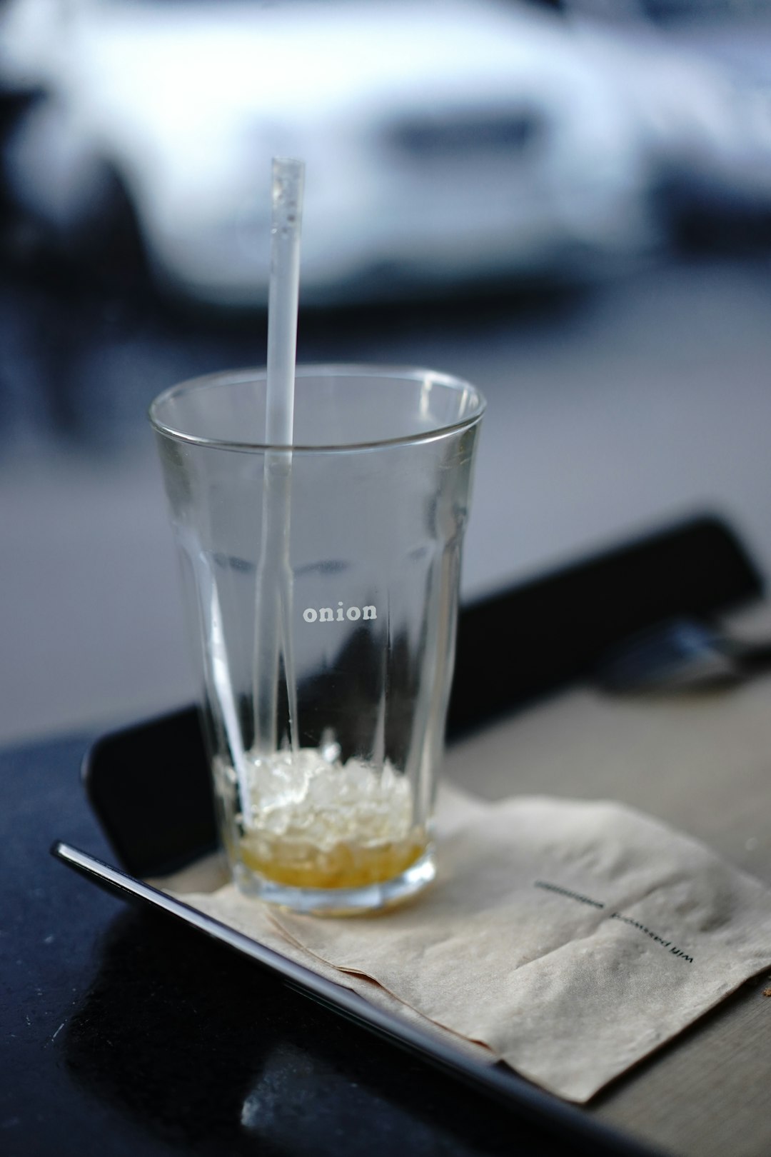 clear drinking glass with white straw