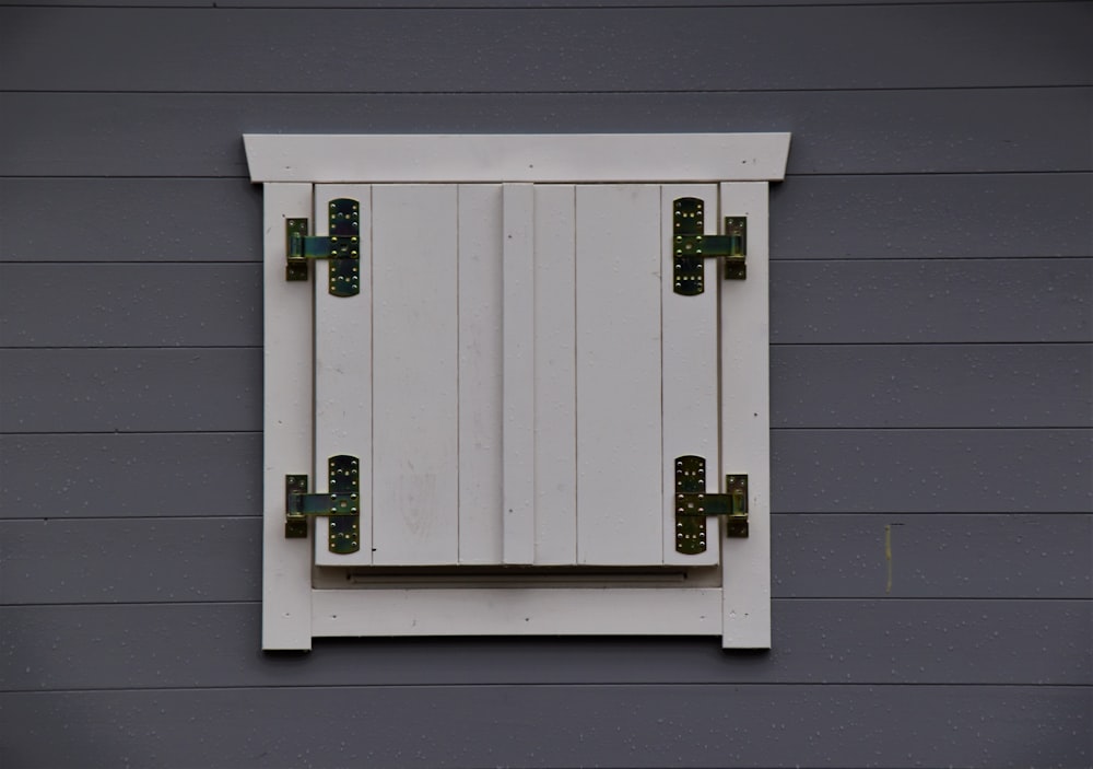 white wooden door with green door lever