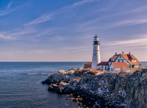 Portland Head Light on a rocky cliff above the ocean in Cape Elizabeth