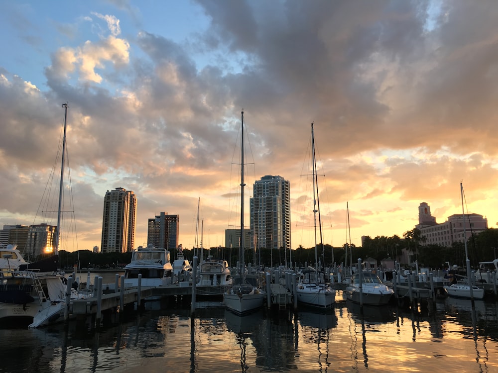 a harbor filled with lots of boats under a cloudy sky