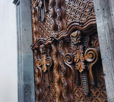 A beautifully crafted wooden door with intricate details, showcasing artisanal craftsmanship.