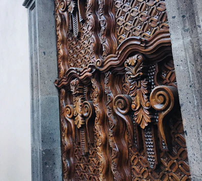 Hand-carved wooden door showcasing intricate patterns.