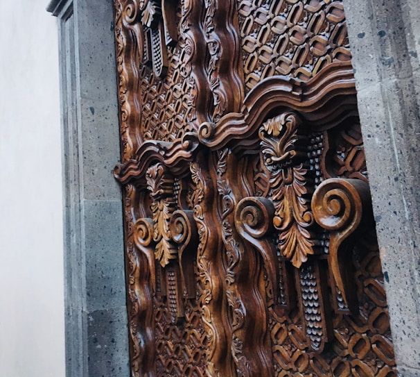 Close-up of the intricate wooden door frame highlighting the craftsmanship of the era.