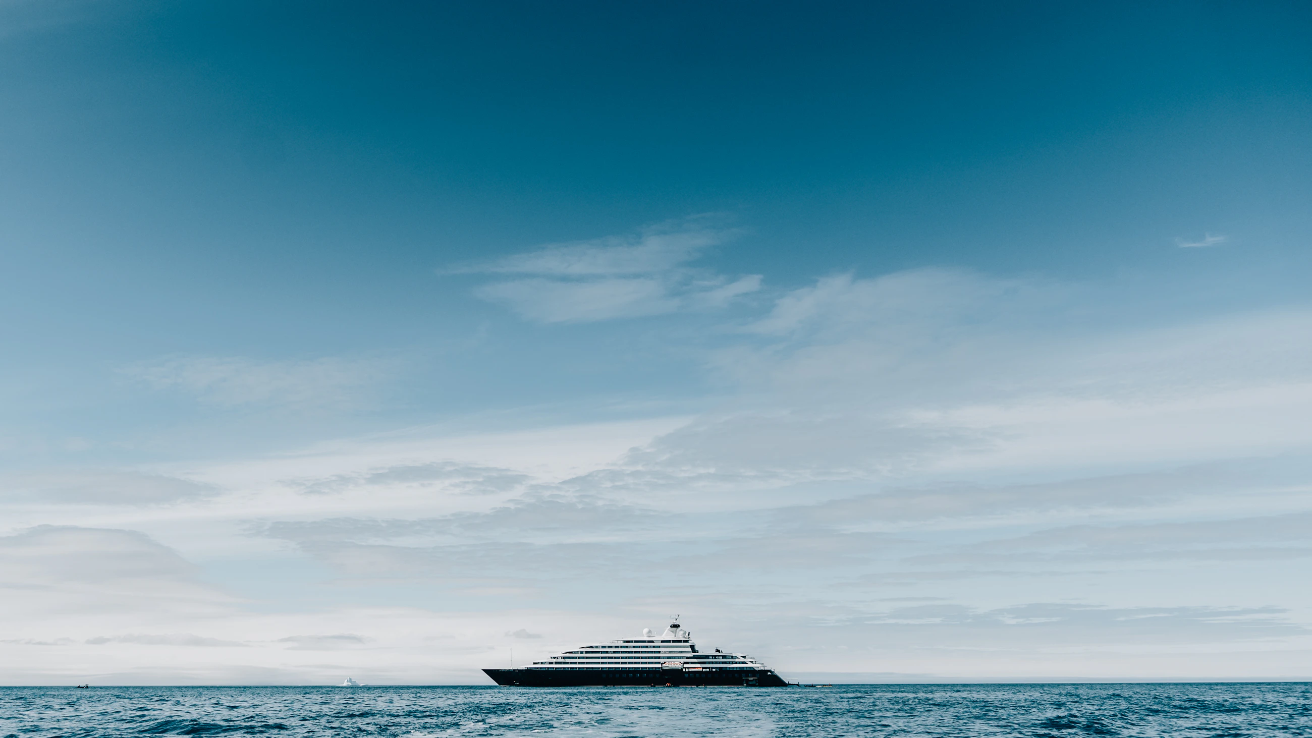 Expedition vessel at sea under open sky