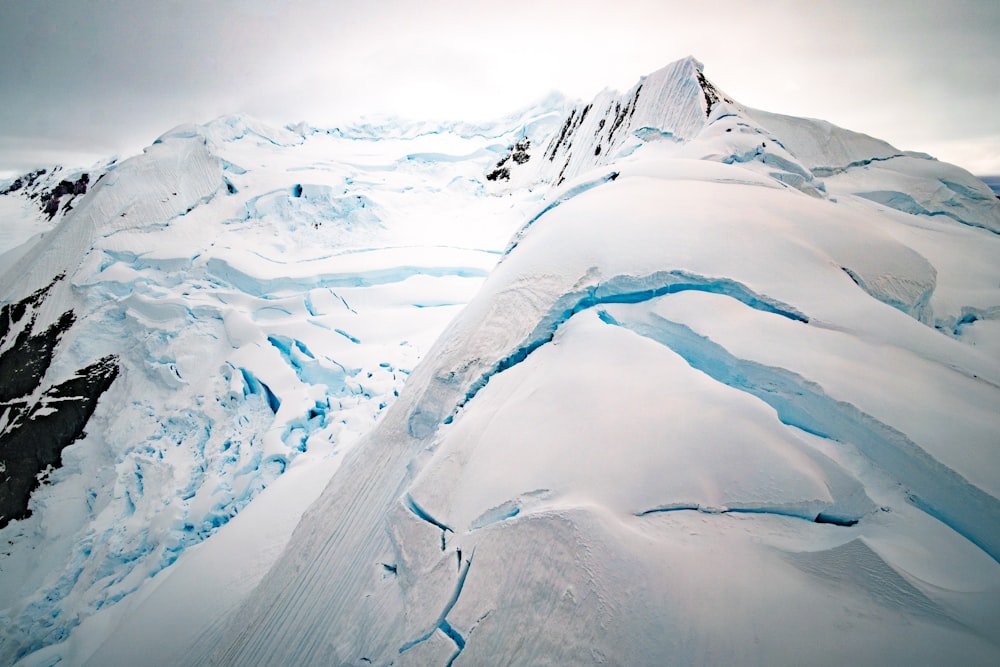 snow covered mountain during daytime