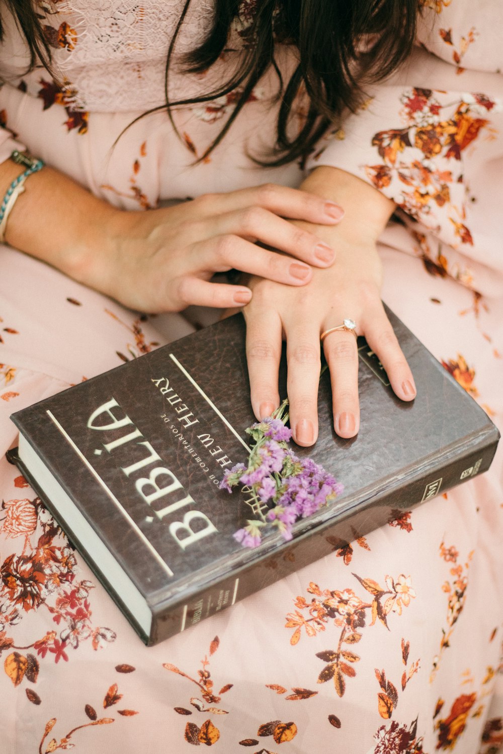 person holding black and white i am a little girl book