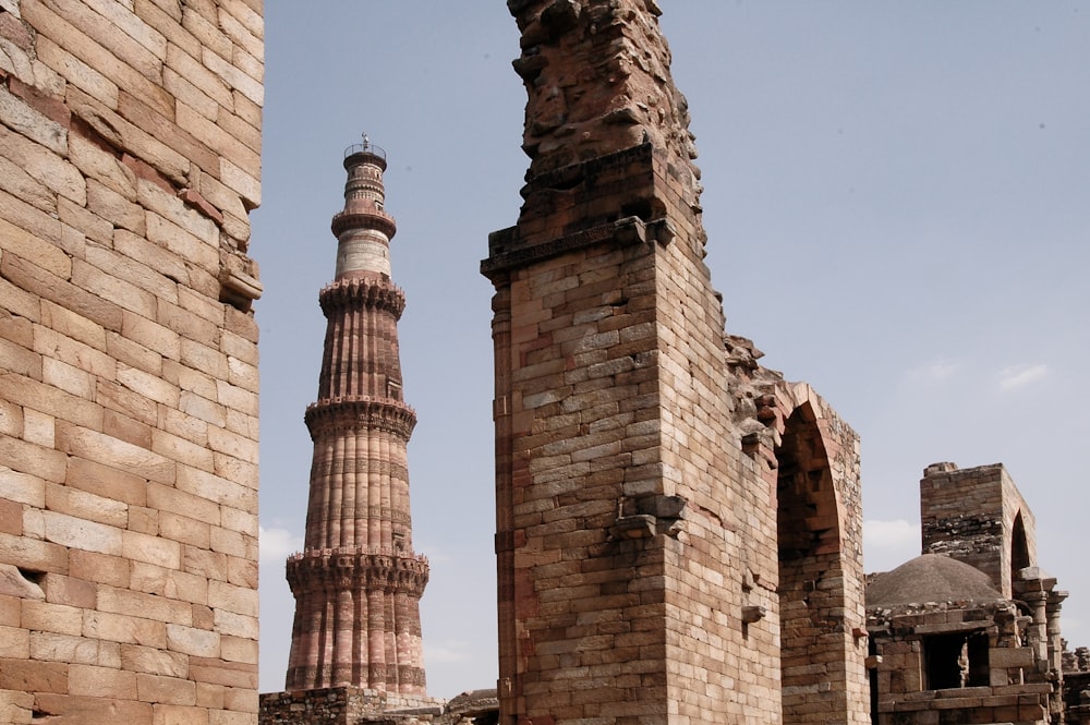 brown brick tower under blue sky during daytime