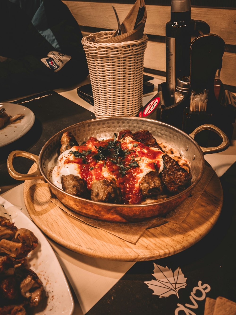 cooked food on brown wooden round tray