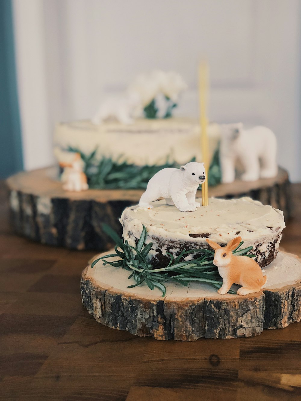 white and brown cake with white icing on top