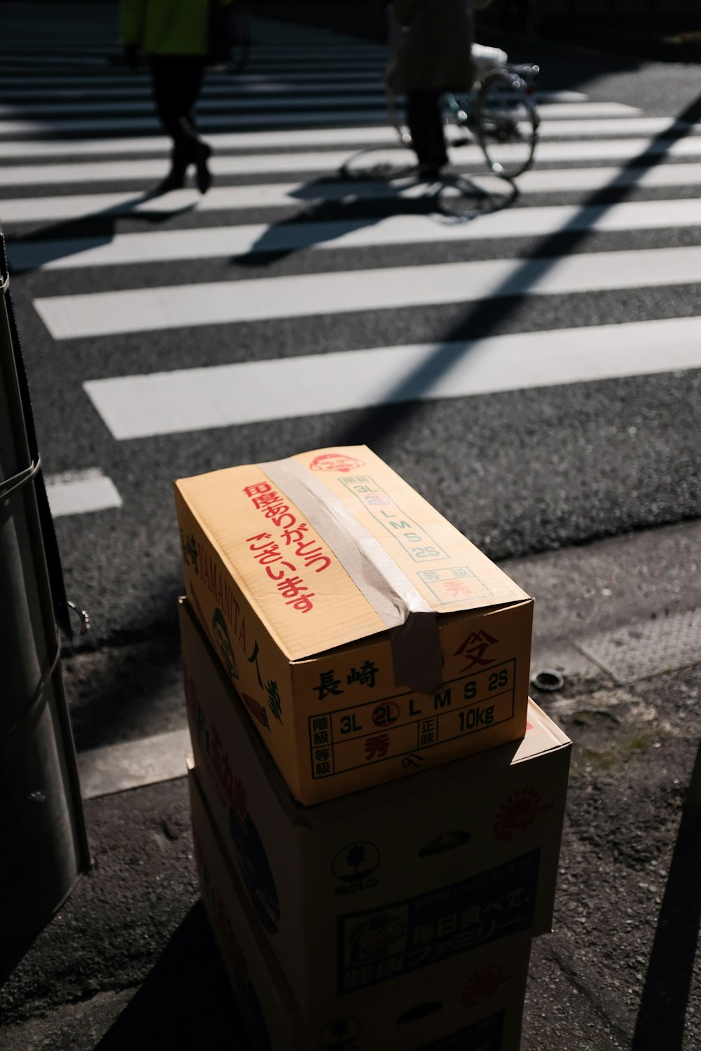 brown cardboard box on gray concrete floor