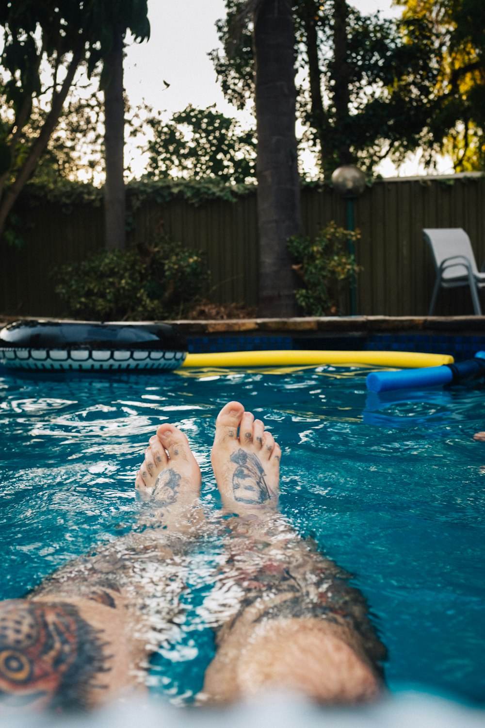 person in swimming pool during daytime