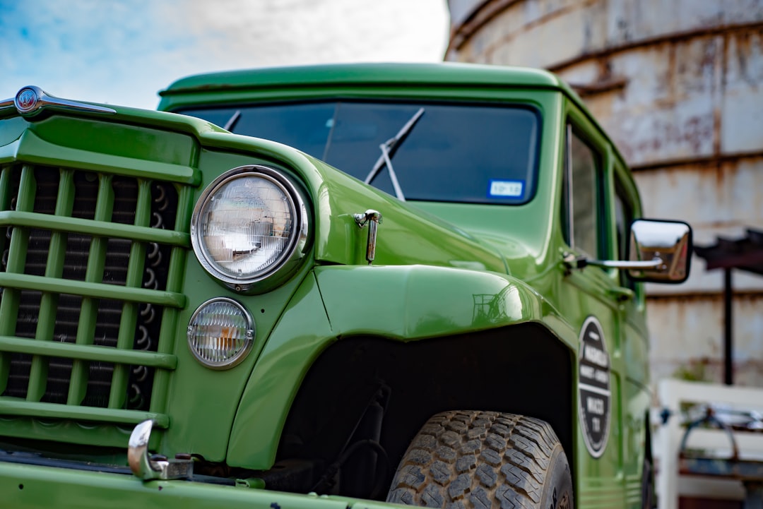 green vintage car in close up photography