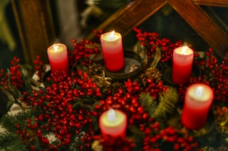red candles on brown wooden table
