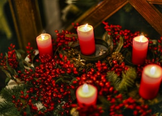 red candles on brown wooden table