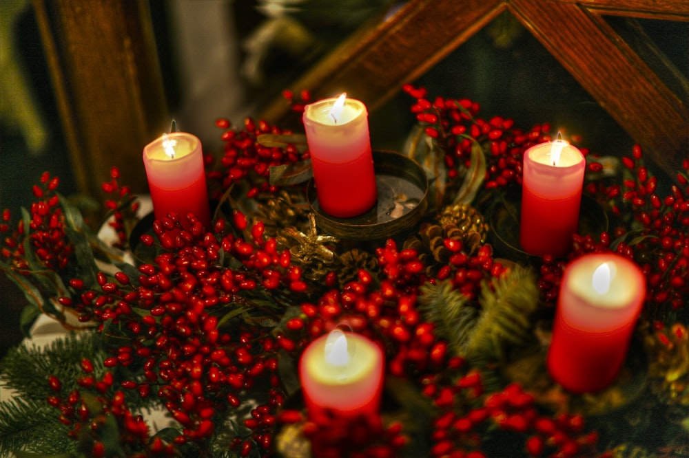 red candles on brown wooden table