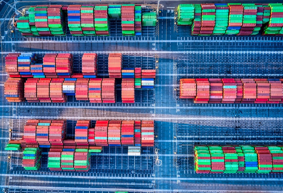 red green and yellow plastic containers, Colorful cargo containers lined up.