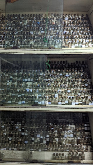 A collection of surplus chemicals in various containers.