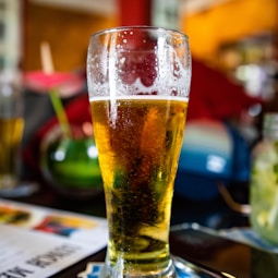 clear drinking glass with beer