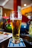 clear drinking glass with beer