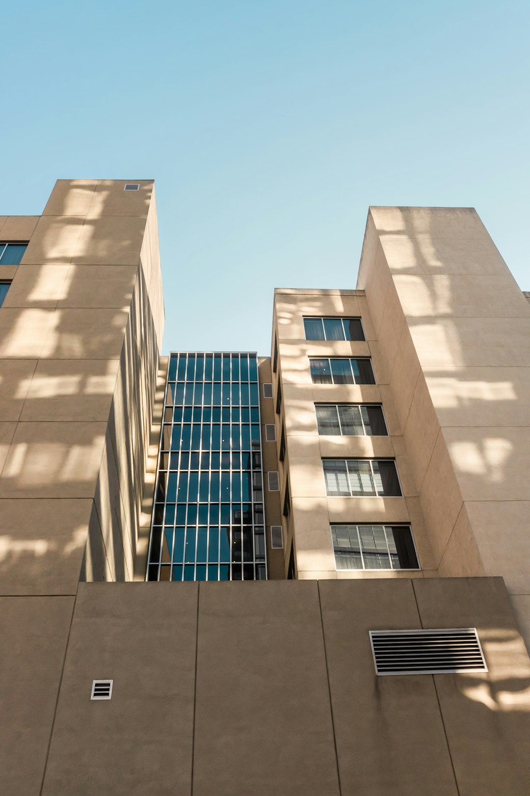 brown concrete building under blue sky during daytime