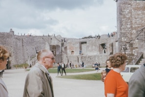 Tourists walking through an ancient castle during a cultural trip organized by Letsgogroup