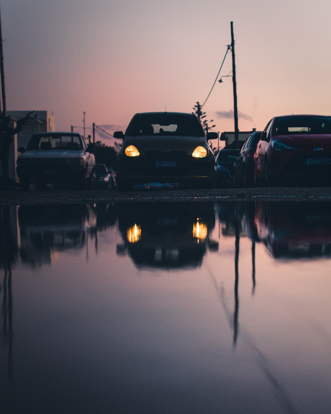 black car on road during night time