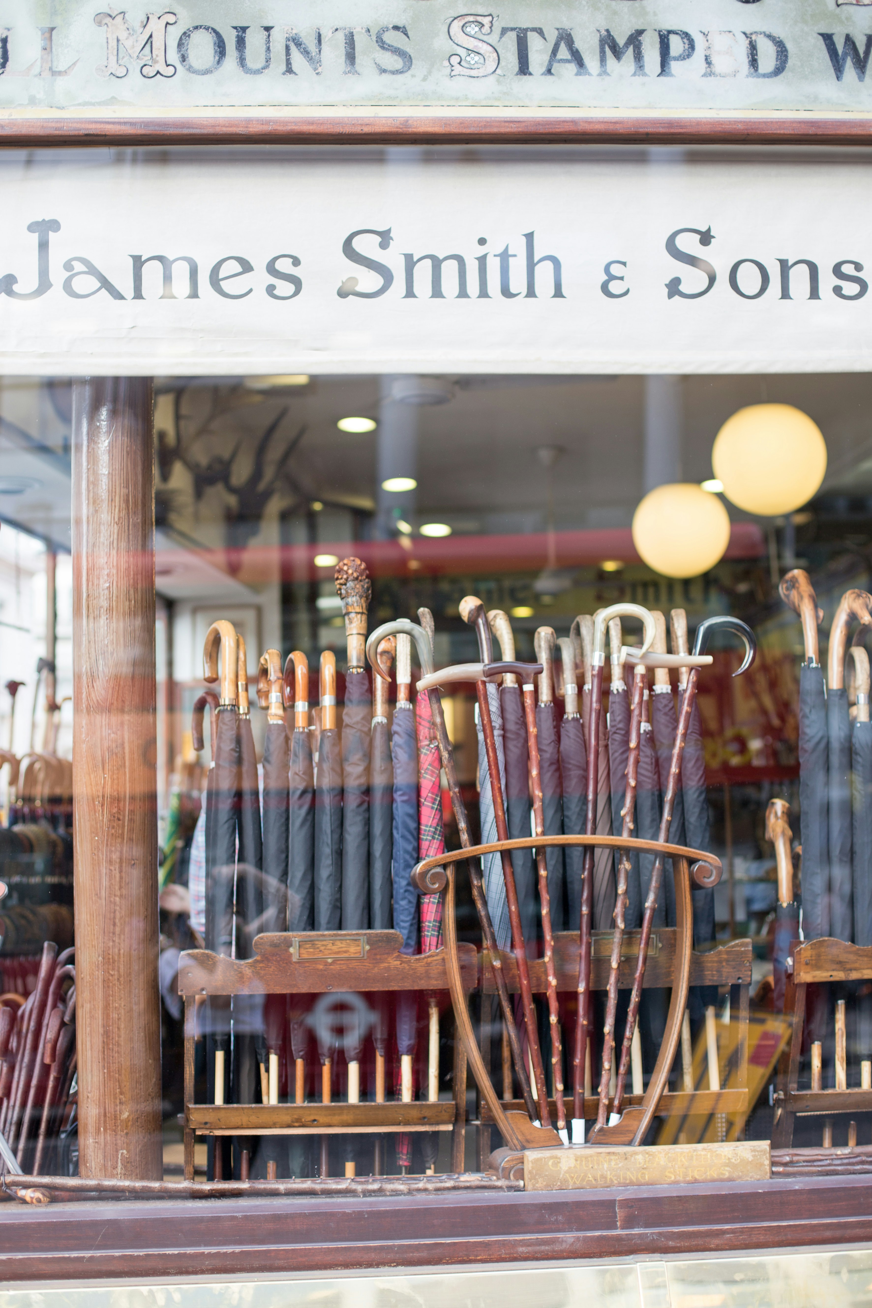 brown wooden chair near glass window