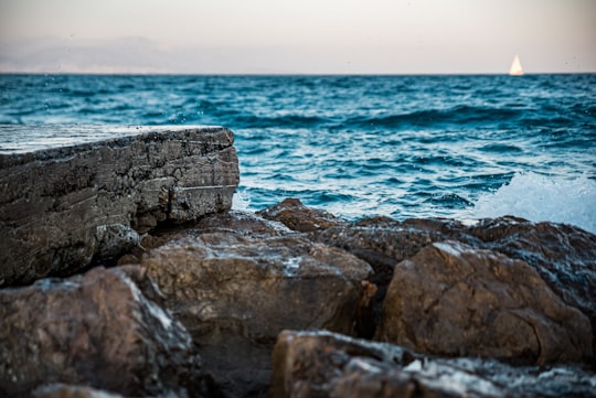 brown and gray rock formation near body of water during daytime in Antibes France