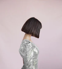 Elegant woman with a flawless bob hairstyle, smiling gently