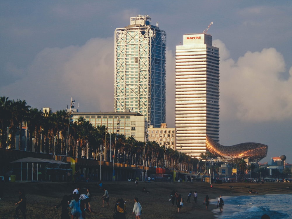 people walking on street near high rise buildings during daytime