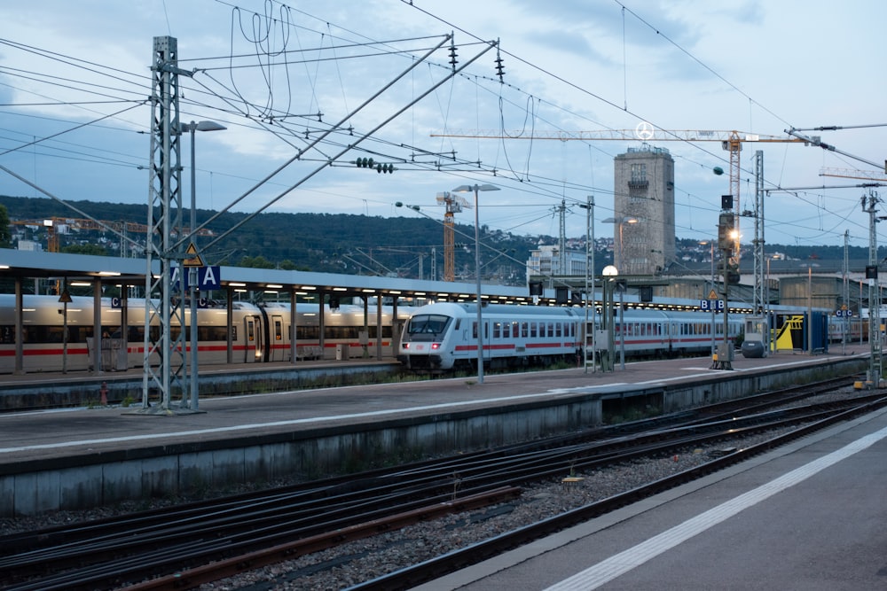 a train on a train track next to a train station