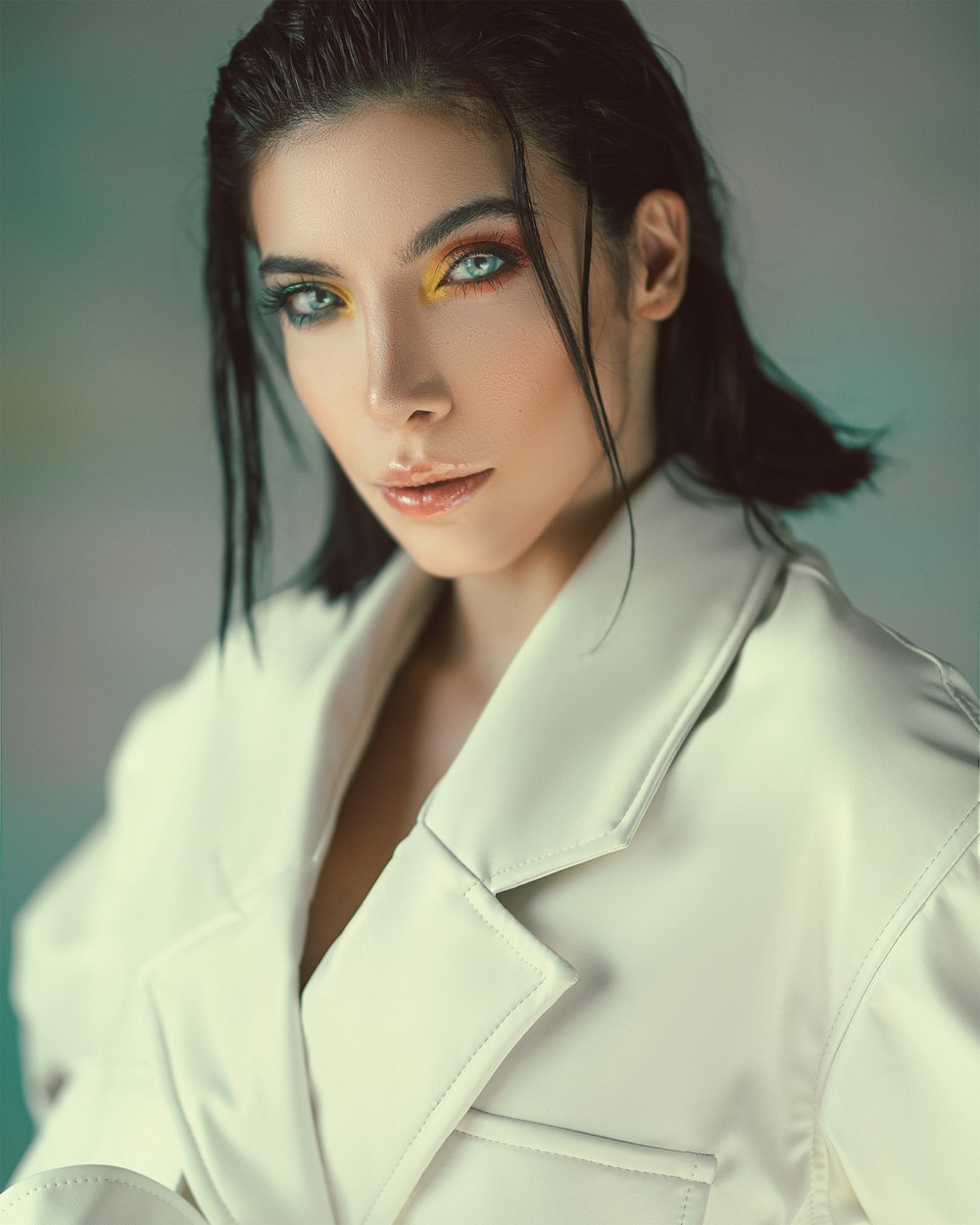 woman in white coat with black hair